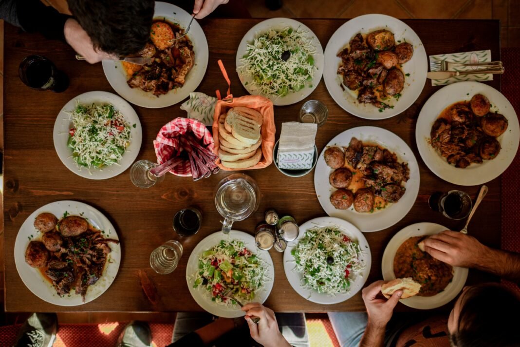 Overhead view of a spread of traditional African family dishes